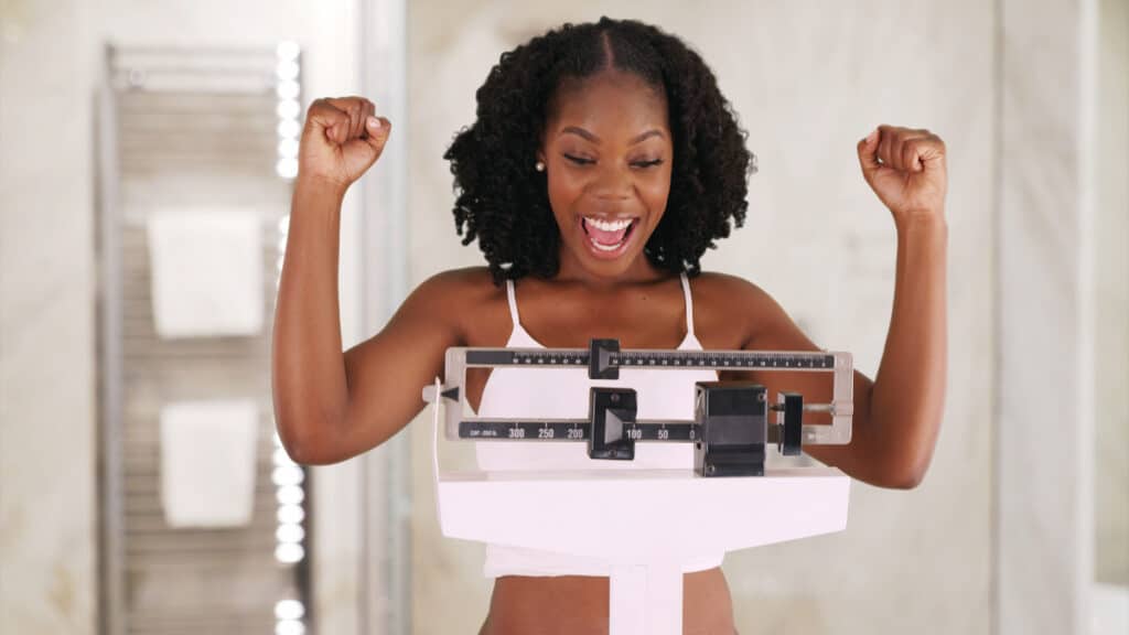 A female seeing if she has the average weight for black women