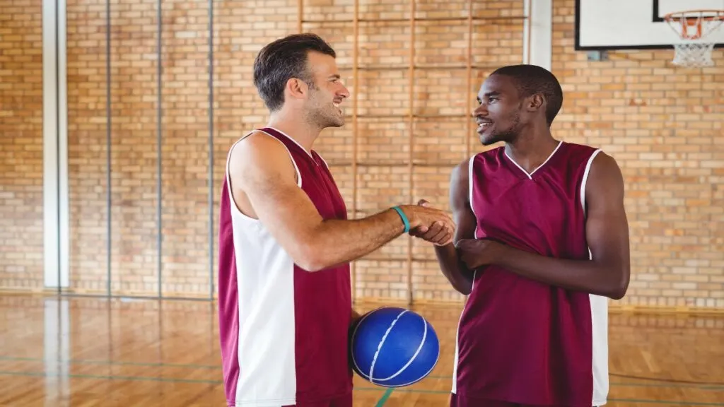 One of the best 6’11 NBA players holding a basketball