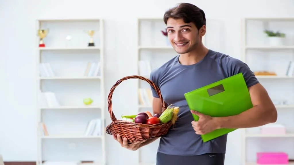 A man showing how to get a healthy weight for a 6'1 male